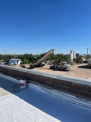 Coated up onto the parapet (Cool Roof Coating, North Denver)