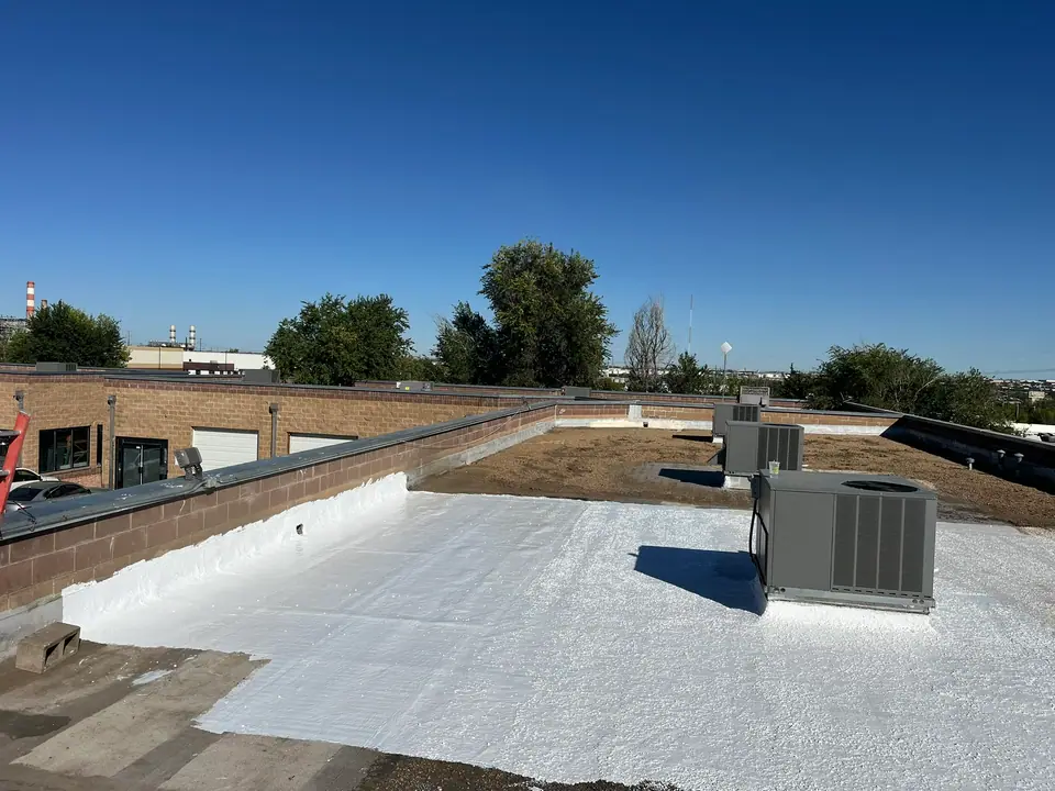 Finished, a bright, reflective roof (Cool Roof Coating, North Denver)