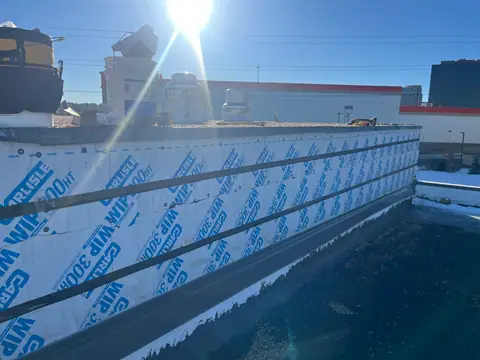 A new weather barrier first (Rooftop Screen Wall & Security Mesh, Denver Tech Center)